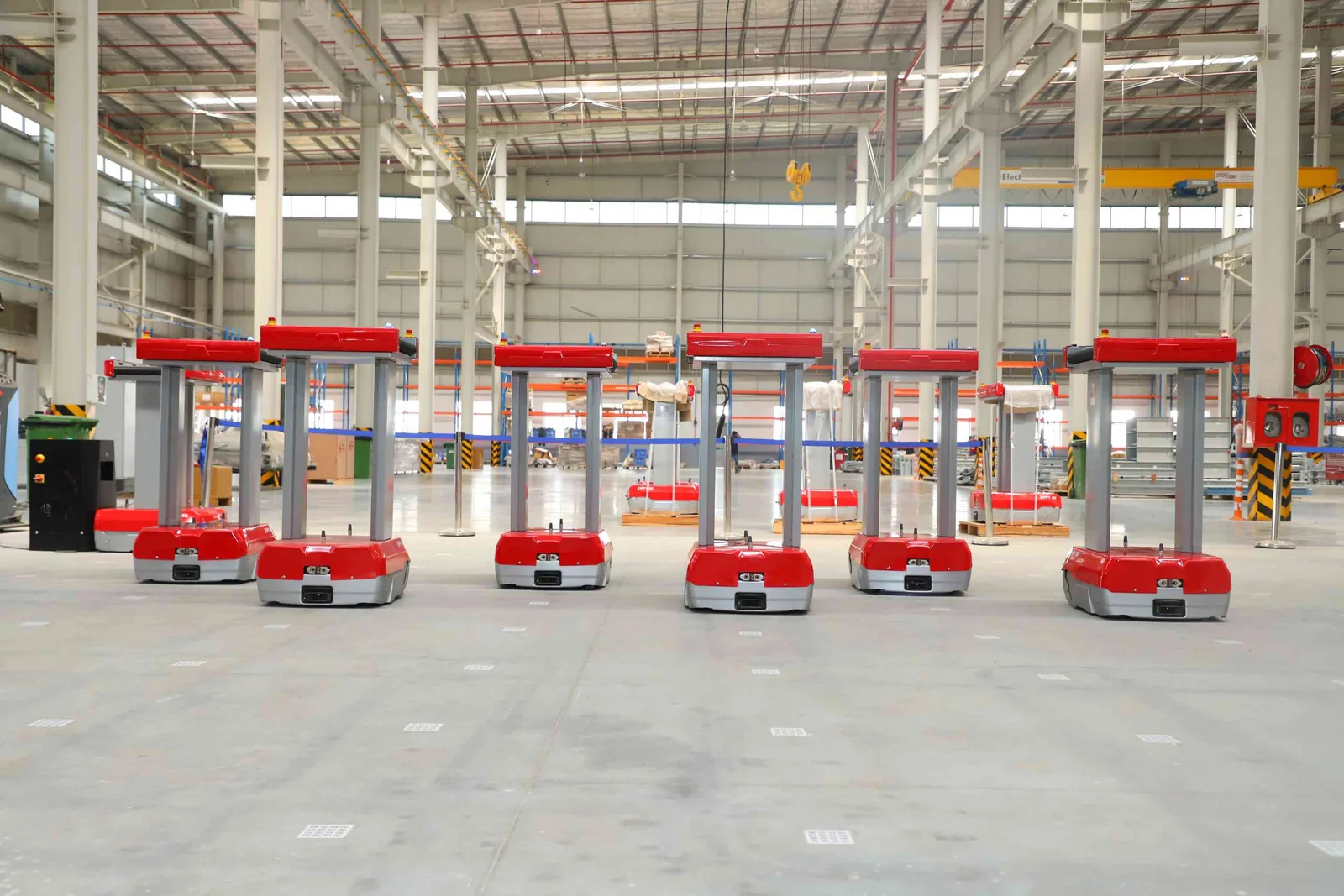 Row of Addverb Zippy robots on a warehouse floor